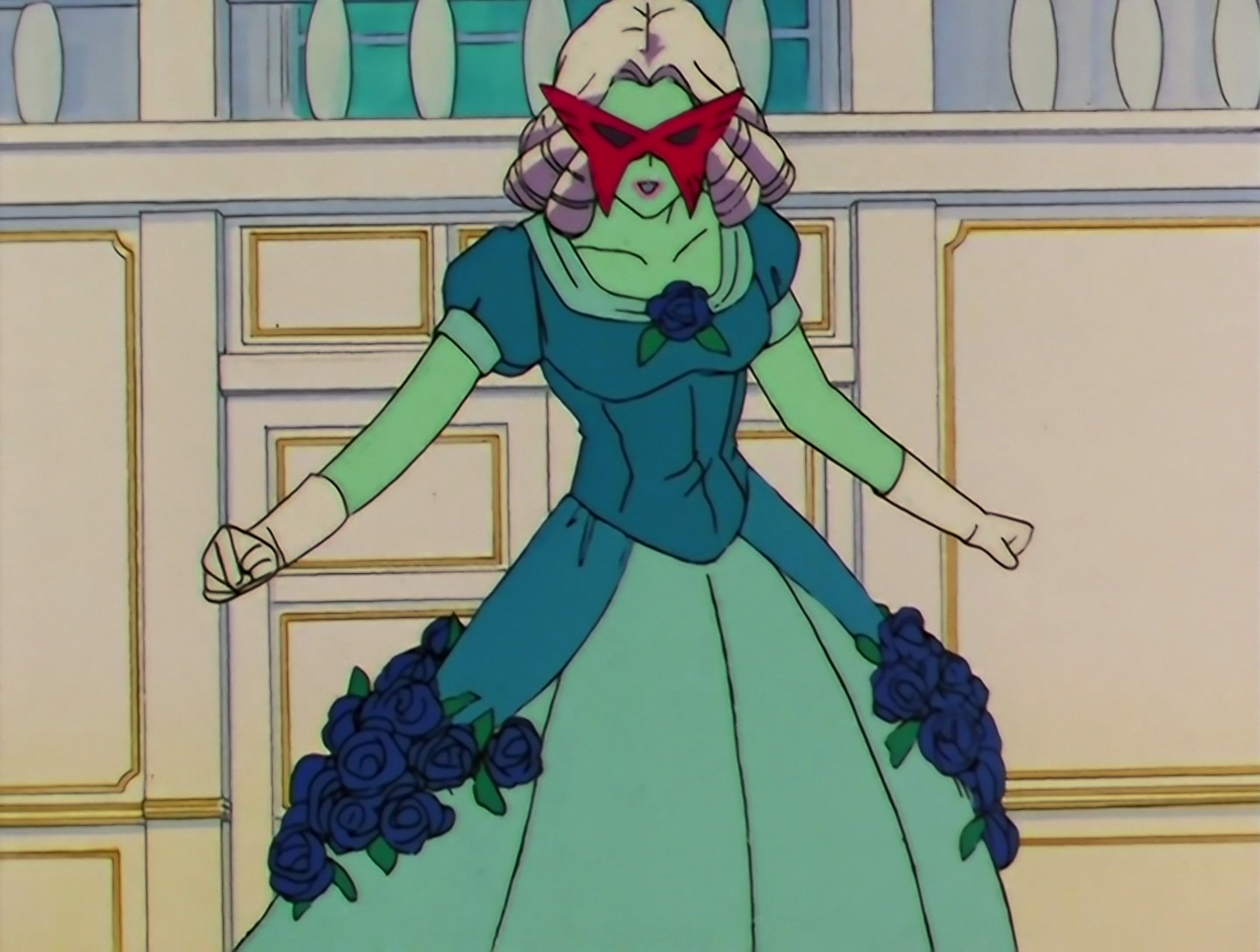 Chikuon, a Daimon from Sailor Moon episode 108. She has turquoise skin and wears a white eighteenth century-style wig. She’s wearing a blue and turquoise ballgown decorated with dark blue roses, and she has a large red domino mask, masquerade ball style.